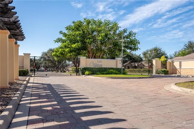a view of a swimming pool with a yard
