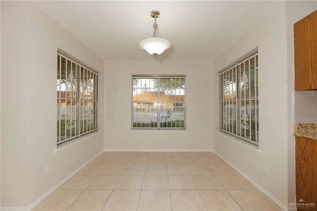 a view of an empty room with windows