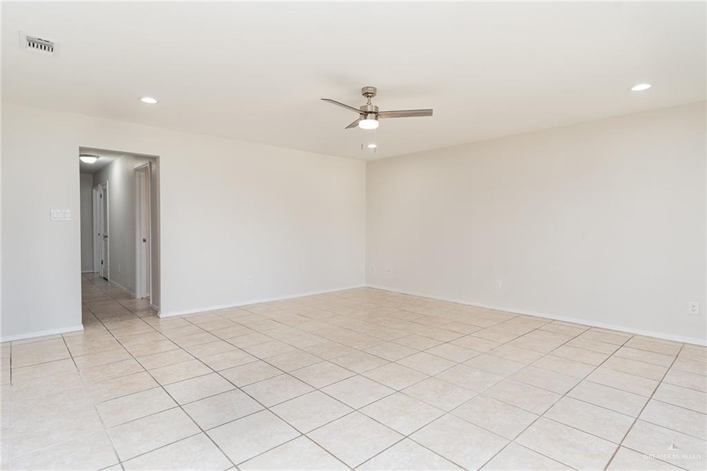 500 East El Rancho Avenue, Unit 26 McAllen, TX 78503 - Photo 14 of 27 an empty room with white walls and ceiling fan