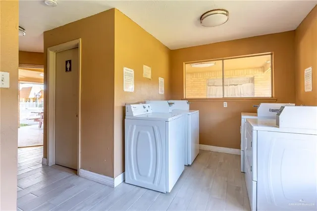 a view of a storage & utility room with washer and dryer