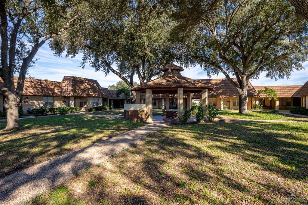 500 East El Rancho Avenue, Unit 26 McAllen, TX 78503 - Photo 2 of 27 a view of a house with a yard