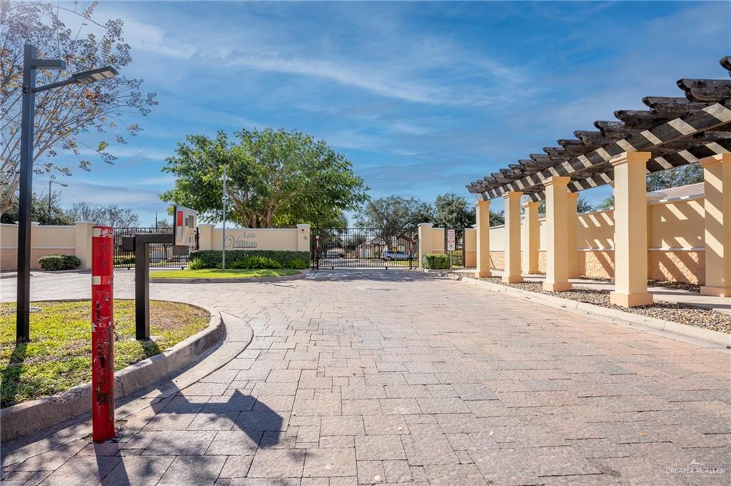 500 East El Rancho Avenue, Unit 26 McAllen, TX 78503 - Photo 21 of 27 a view of swimming pool with lawn chairs and plants