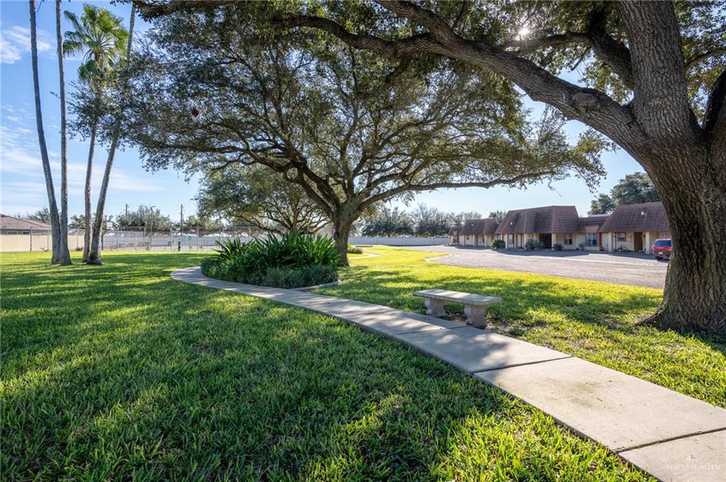 500 East El Rancho Avenue, Unit 26 McAllen, TX 78503 - Photo 3 of 27 a view of a swimming pool with an outdoor space and seating area