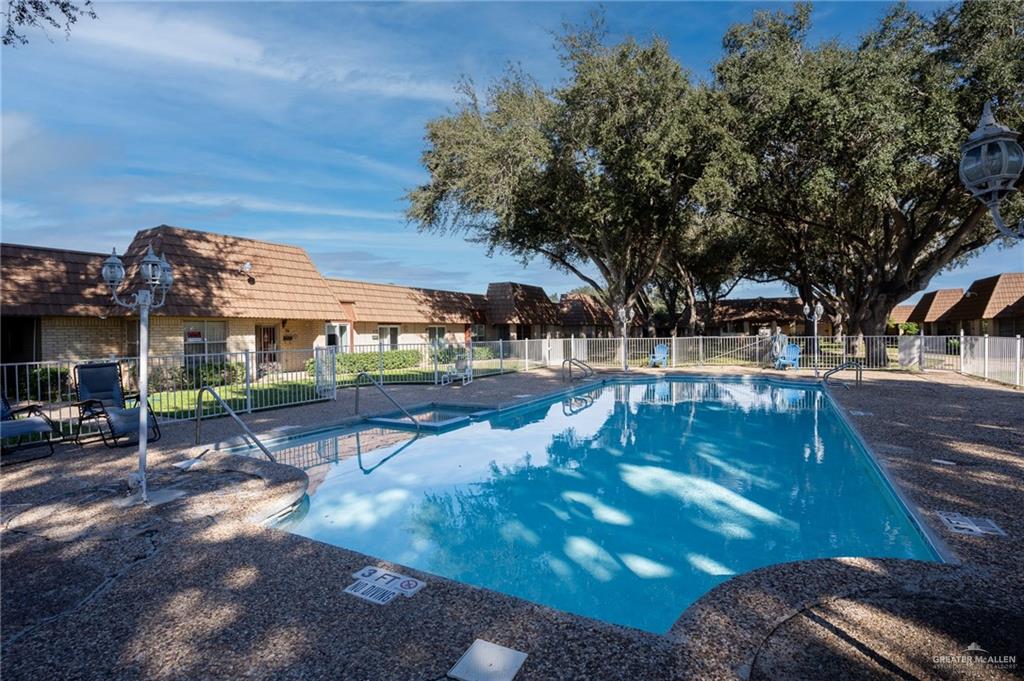 500 East El Rancho Avenue, Unit 26 McAllen, TX 78503 - Photo 4 of 27 a view of a swimming pool with lounge chairs