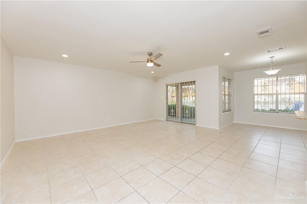 500 East El Rancho Avenue, Unit 26 McAllen, TX 78503 - Photo 7 of 27 an empty room with windows and ceiling fan