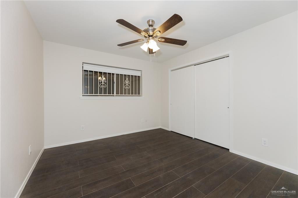 500 East El Rancho Avenue, Unit 26 McAllen, TX 78503 - Photo 10 of 27 a view of wooden floor and a chandelier fan in a room