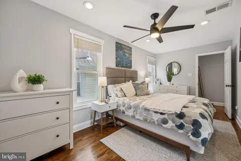 a bedroom with a bed and a dresser