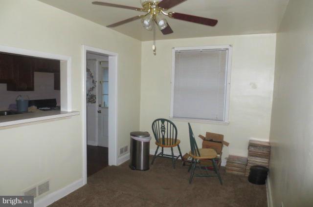 5506 Force Road Baltimore, MD 21206 - Photo 10 of 18 a view of a workspace with furniture and a flat screen tv