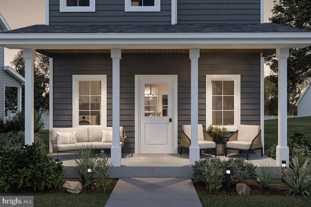 205 A Ridge Avenue Taneytown, MD 21787 - Photo 4 of 7 a front view of a house with outdoor seating and porch