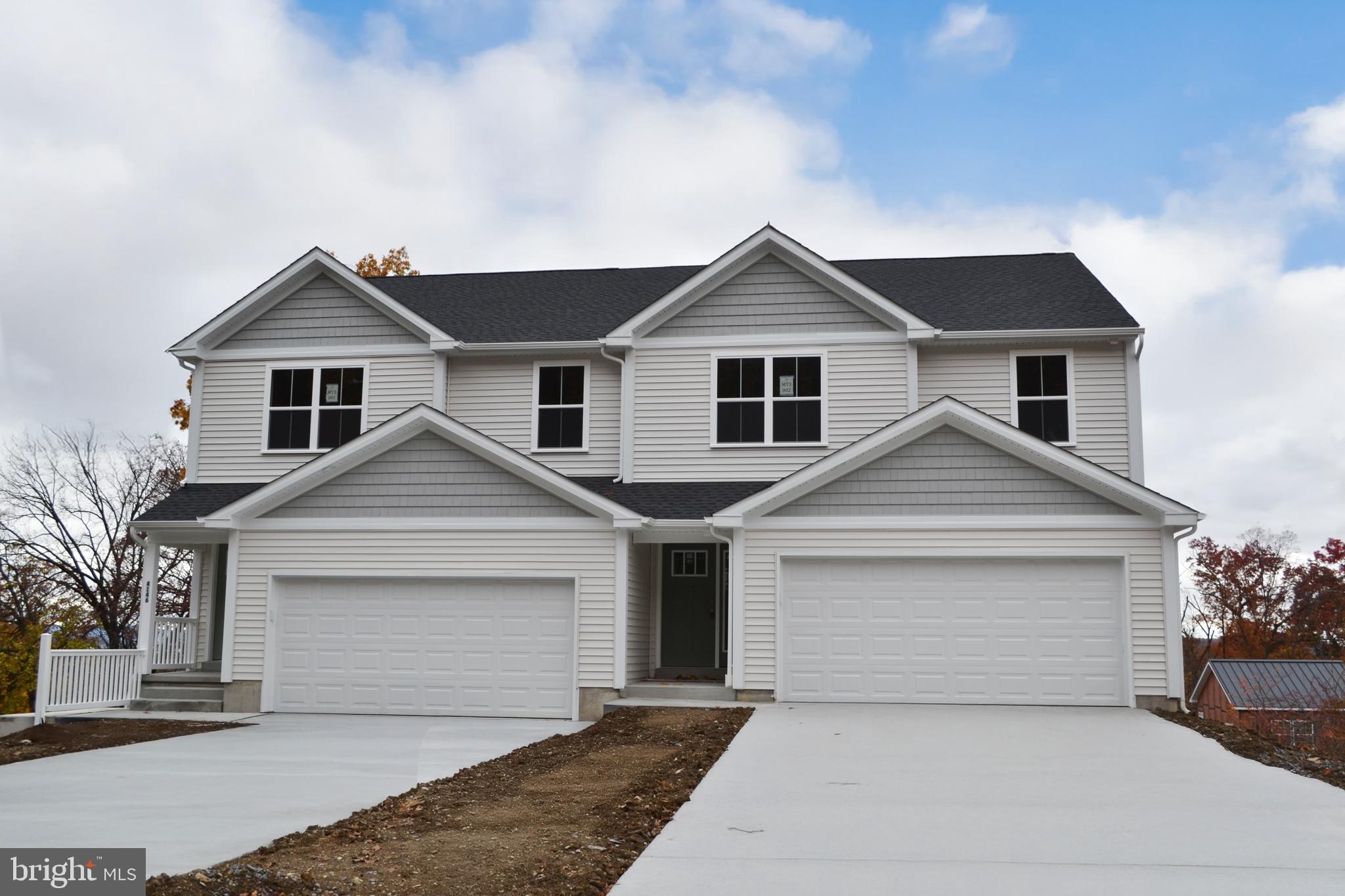 4148 Sefranka Road, Unit (LOT 2) Temple, PA 19560 - Photo 1 of 13 a front view of a house with yard