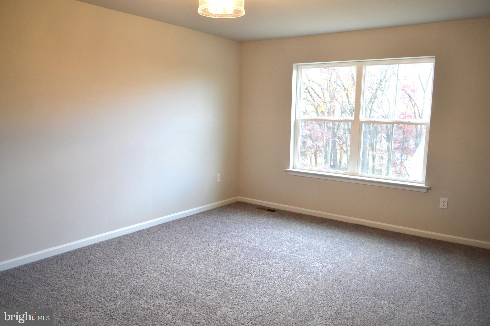 4148 Sefranka Road, Unit (LOT 2) Temple, PA 19560 - Photo 11 of 13 an empty room with a window