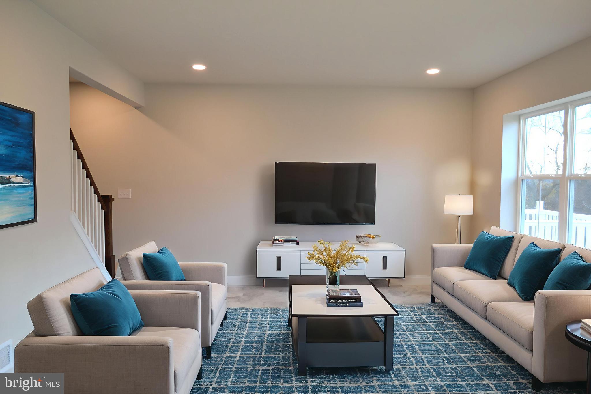 4148 Sefranka Road, Unit (LOT 2) Temple, PA 19560 - Photo 5 of 13 a living room with furniture and a flat screen tv