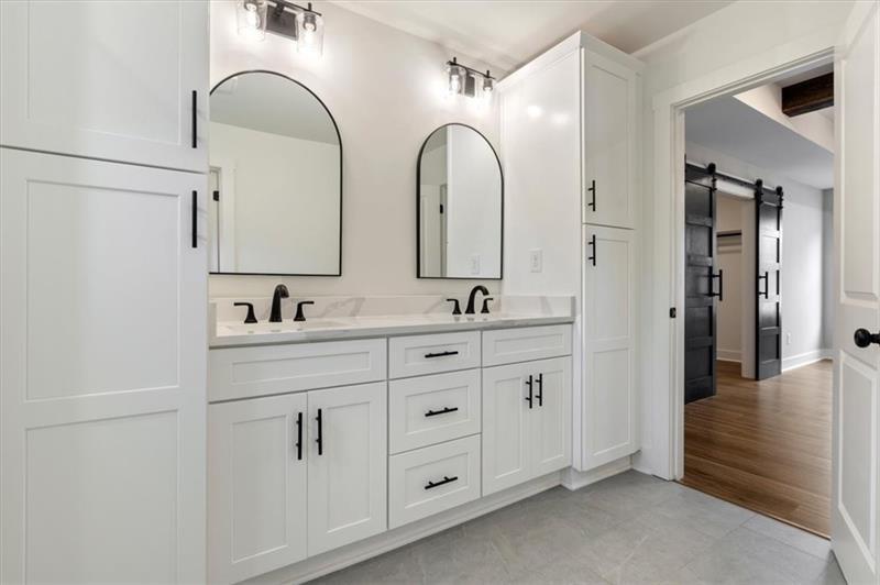 131 Old Alabama Road Southeast Emerson, GA 30137 - Photo 25 of 44 a spacious bathroom with a double vanity sink shower and a mirror
