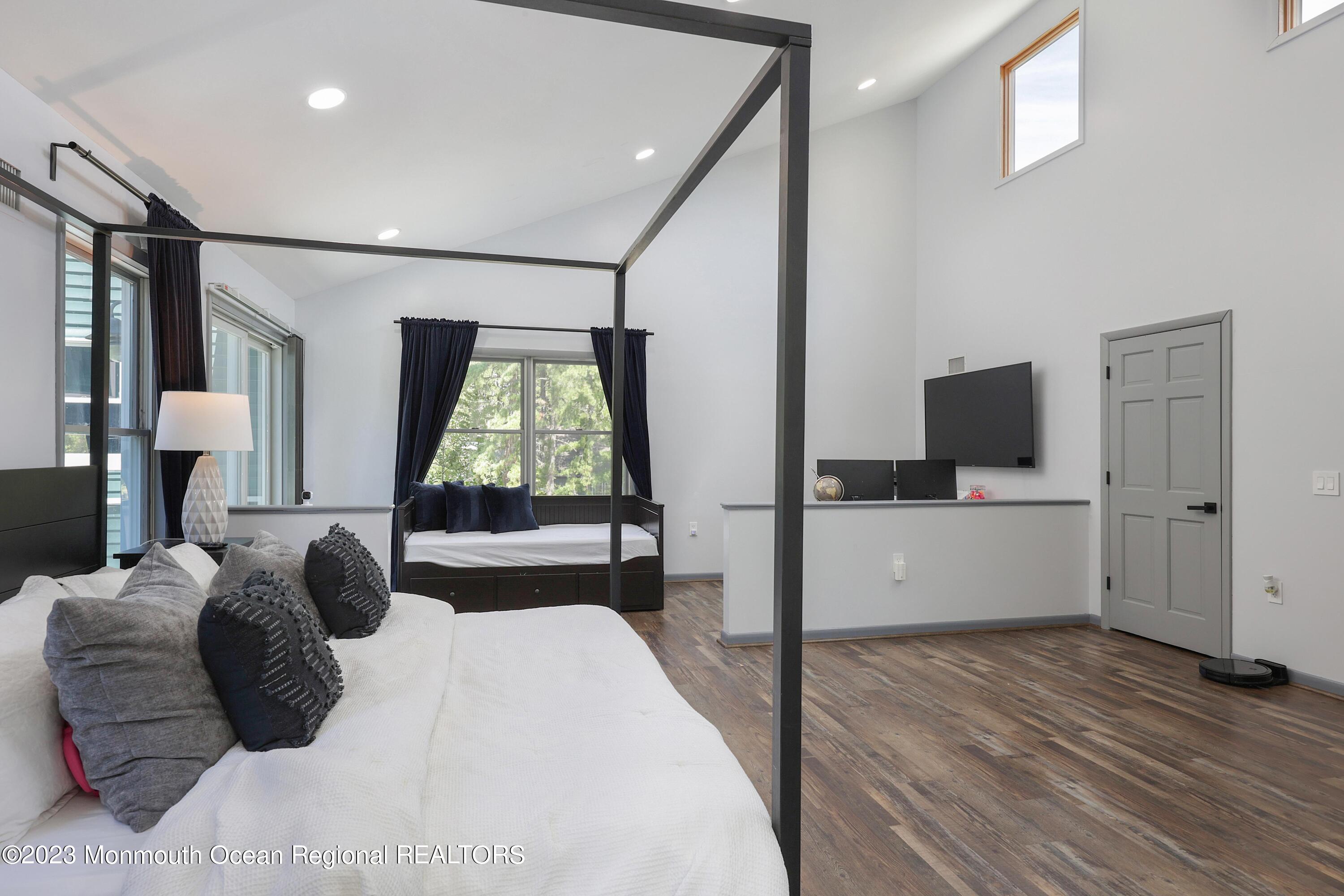 2450 Capshaw Road Forked River, NJ 08731 - Photo 20 of 37 a bedroom with a large bed and a window