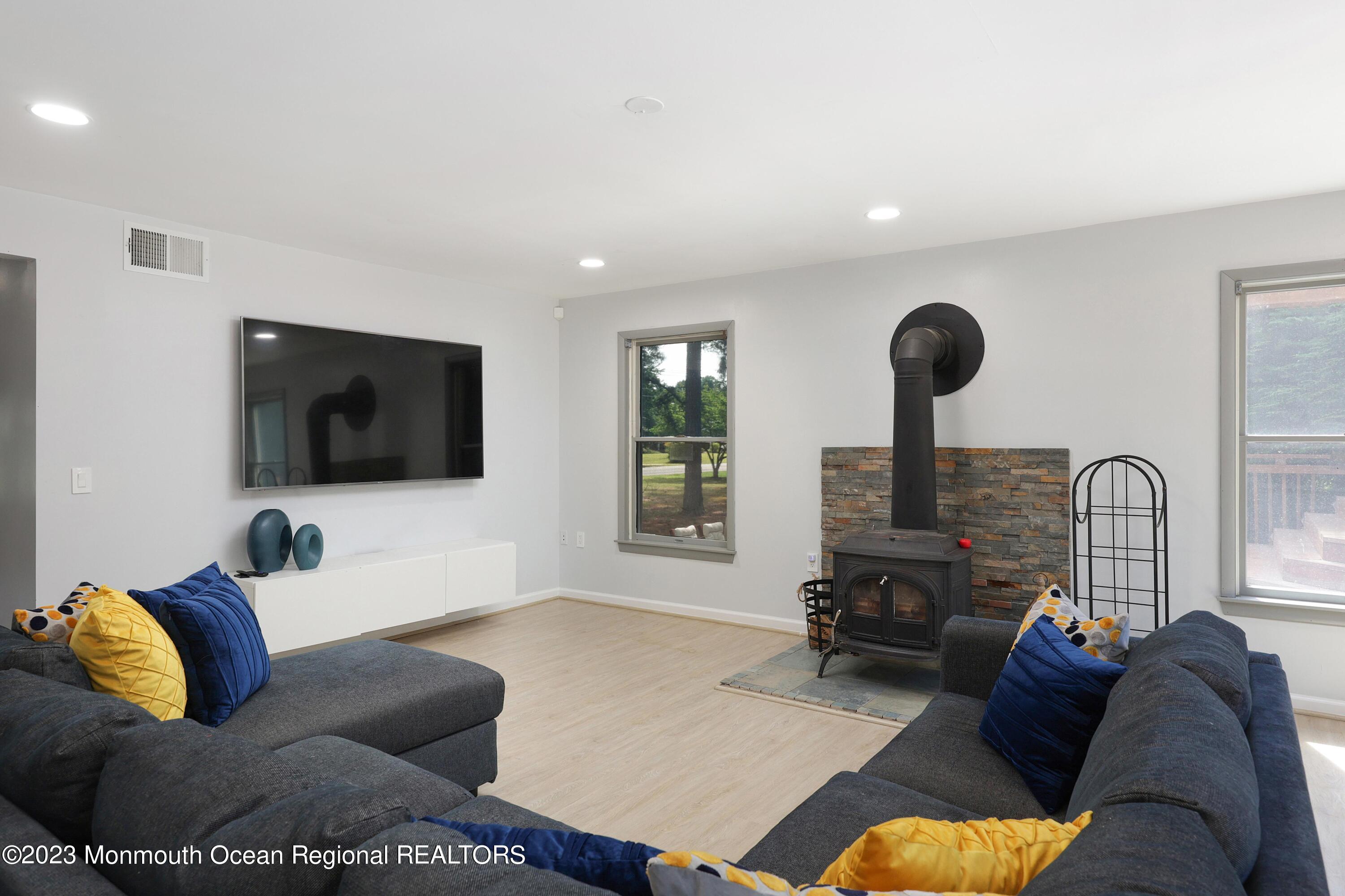 2450 Capshaw Road Forked River, NJ 08731 - Photo 27 of 37 a living room with furniture and a flat screen tv