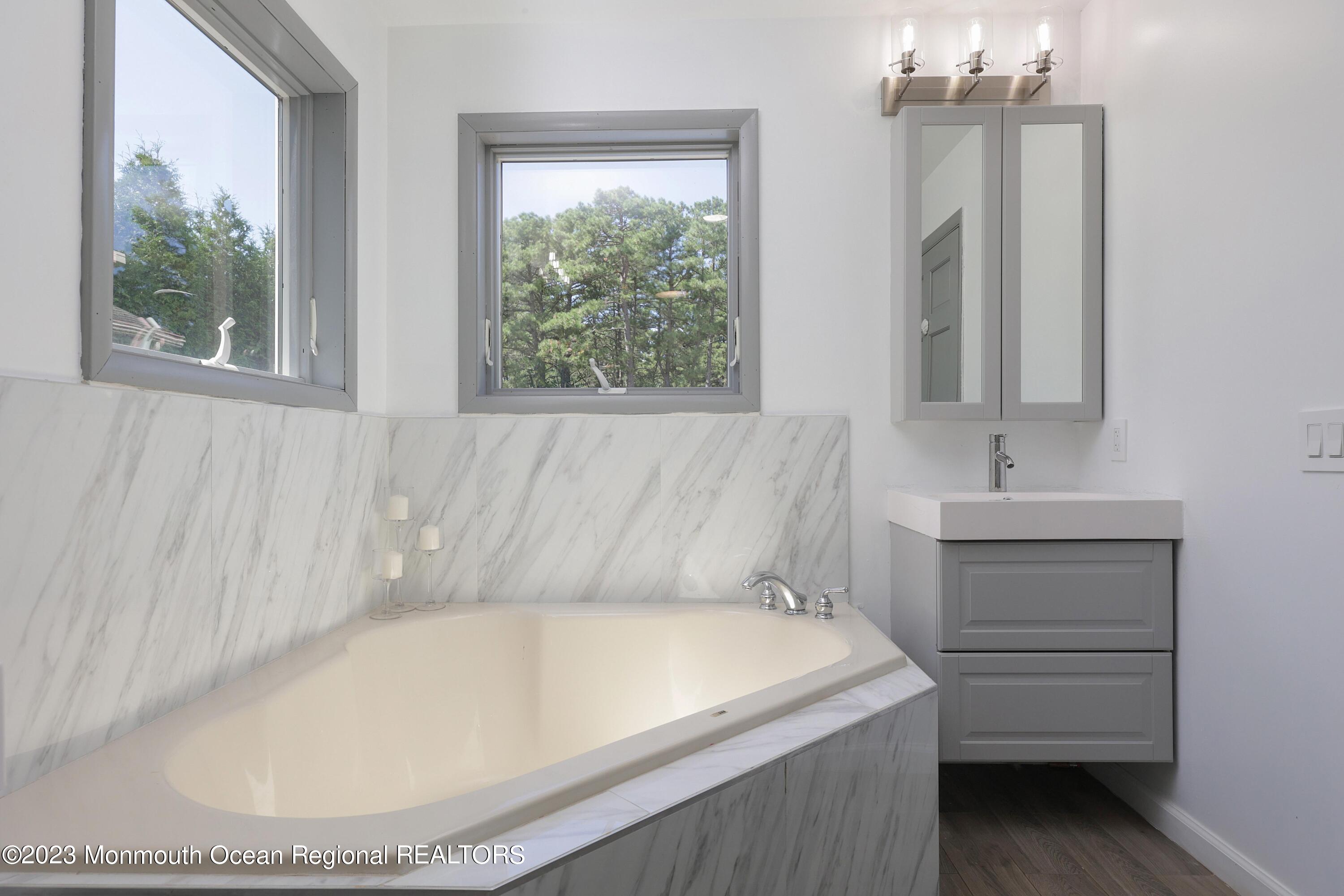 2450 Capshaw Road Forked River, NJ 08731 - Photo 28 of 37 a bathroom with a sink and a bathtub