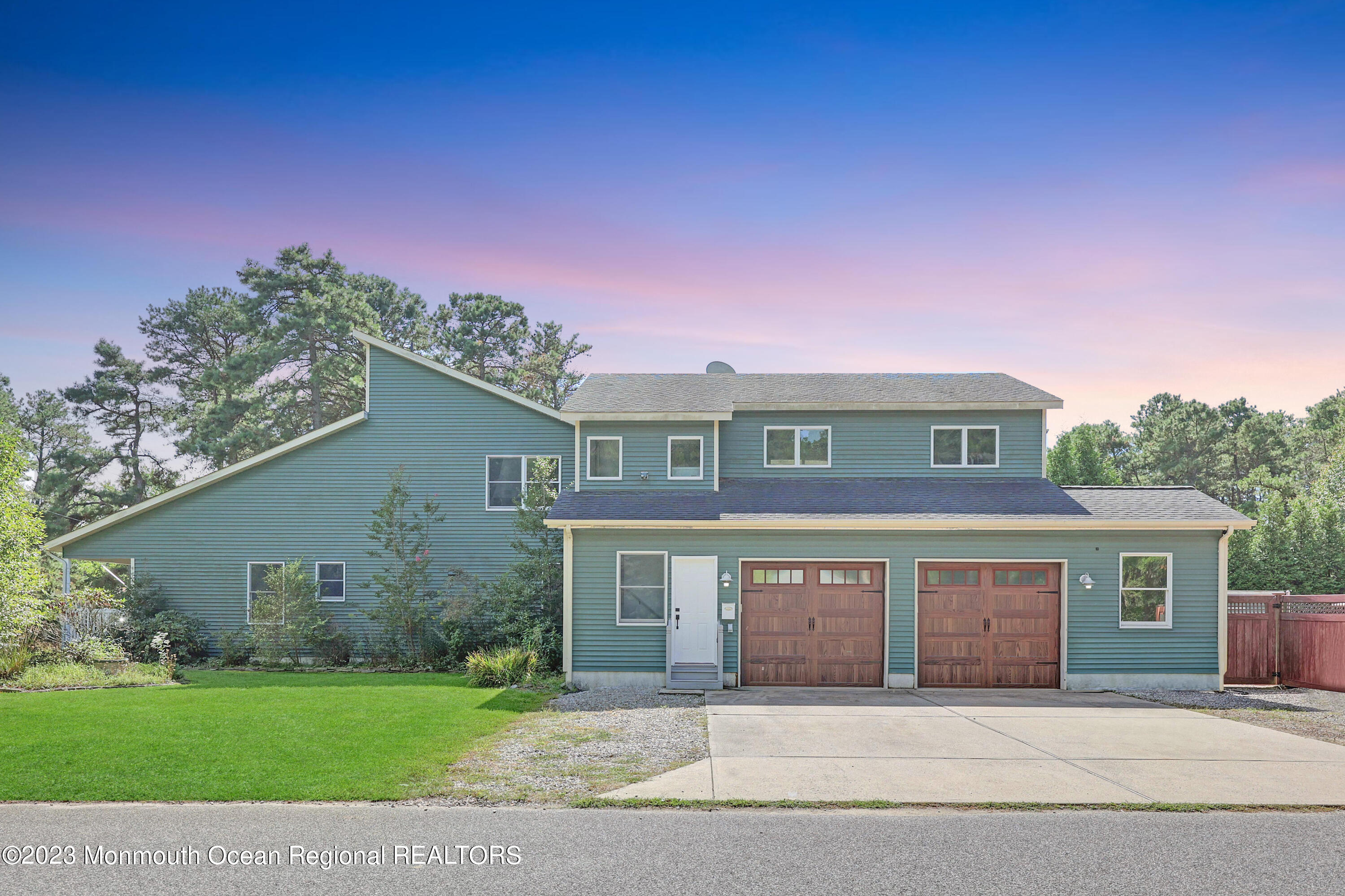 2450 Capshaw Road Forked River, NJ 08731 - Photo 5 of 37 a front view of a house with a garden