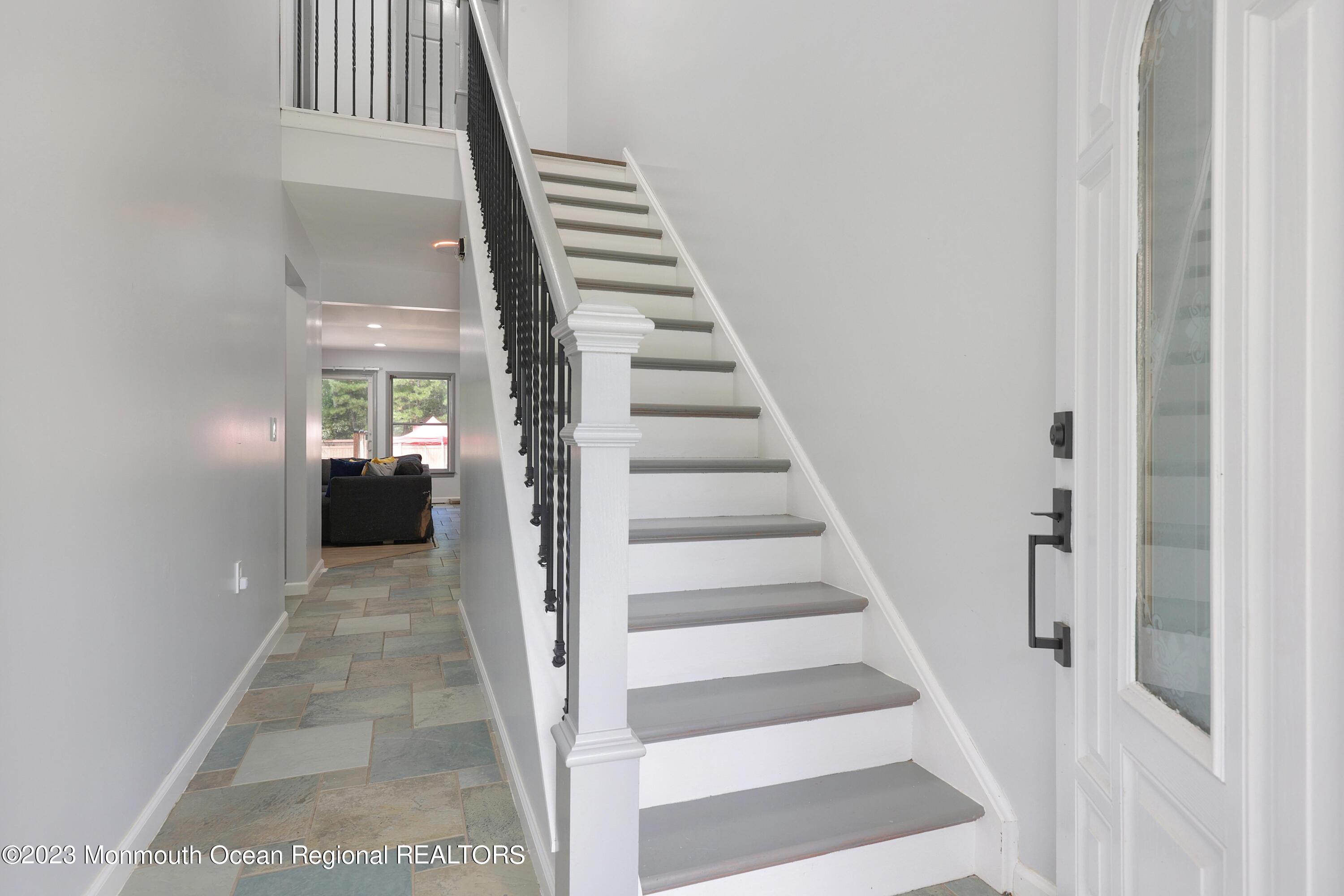 2450 Capshaw Road Forked River, NJ 08731 - Photo 9 of 37 a view of a hallway with wooden floor and entryway