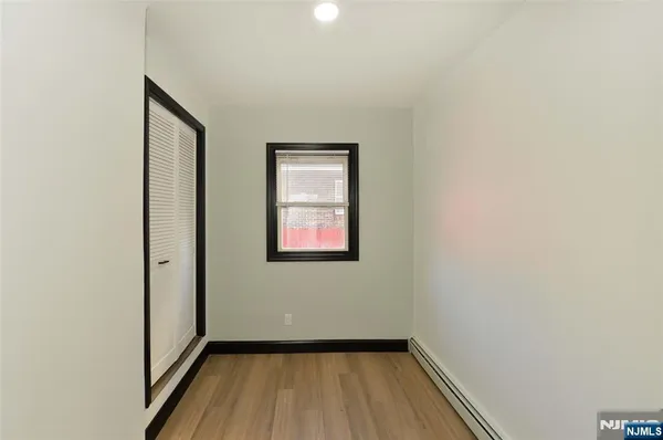 a view of a hallway with a small yard