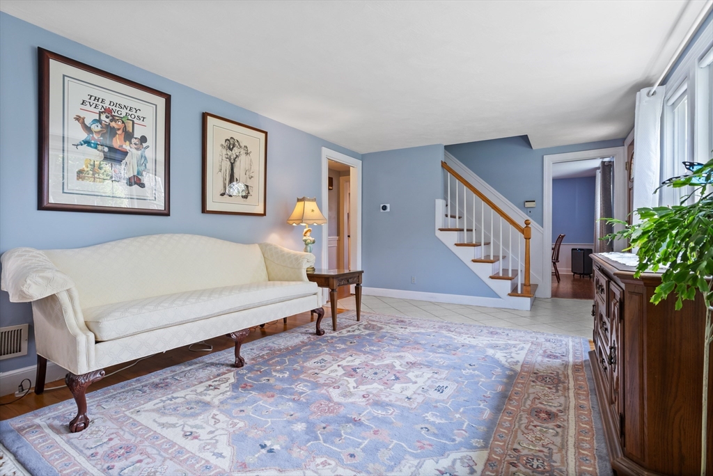 32 Melvin Road Arlington, MA 02474 - Photo 11 of 39 a living room with furniture and a potted plant