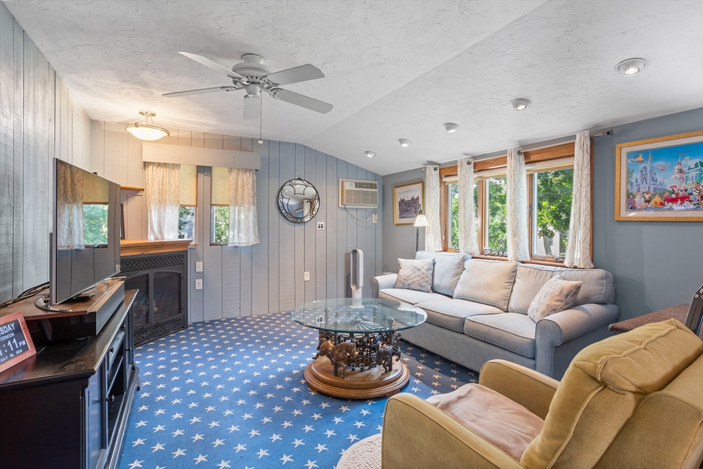 32 Melvin Road Arlington, MA 02474 - Photo 15 of 39 a living room with furniture and a large window