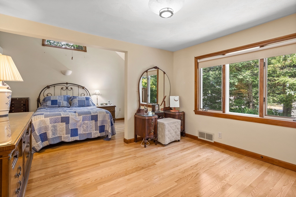 32 Melvin Road Arlington, MA 02474 - Photo 18 of 39 a bedroom with furniture and a large window