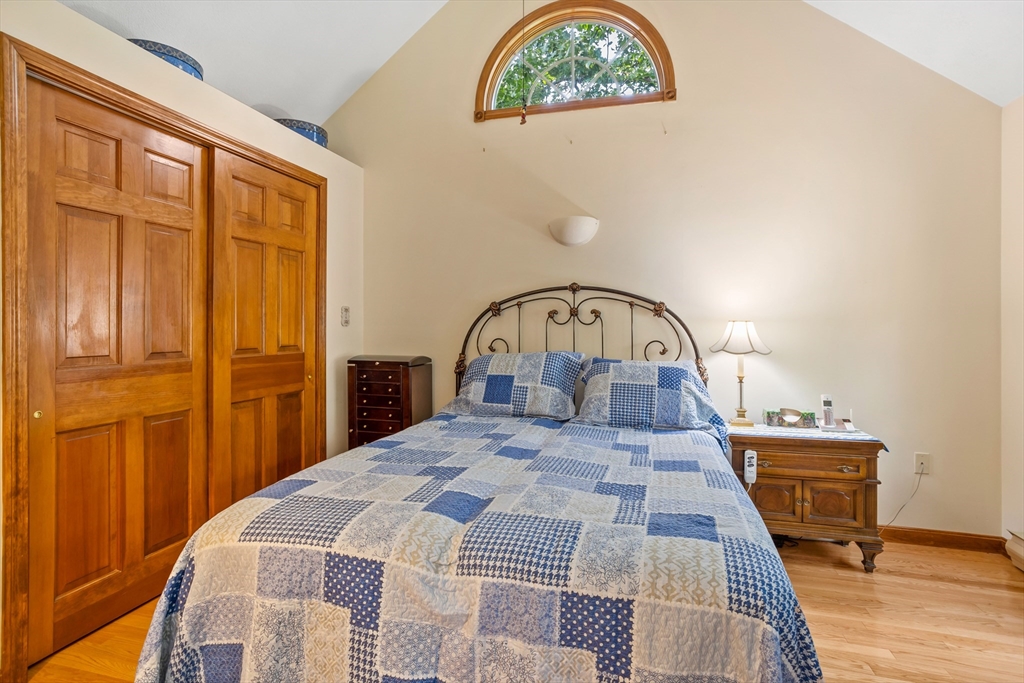 32 Melvin Road Arlington, MA 02474 - Photo 20 of 39 a bedroom with a bed and a table