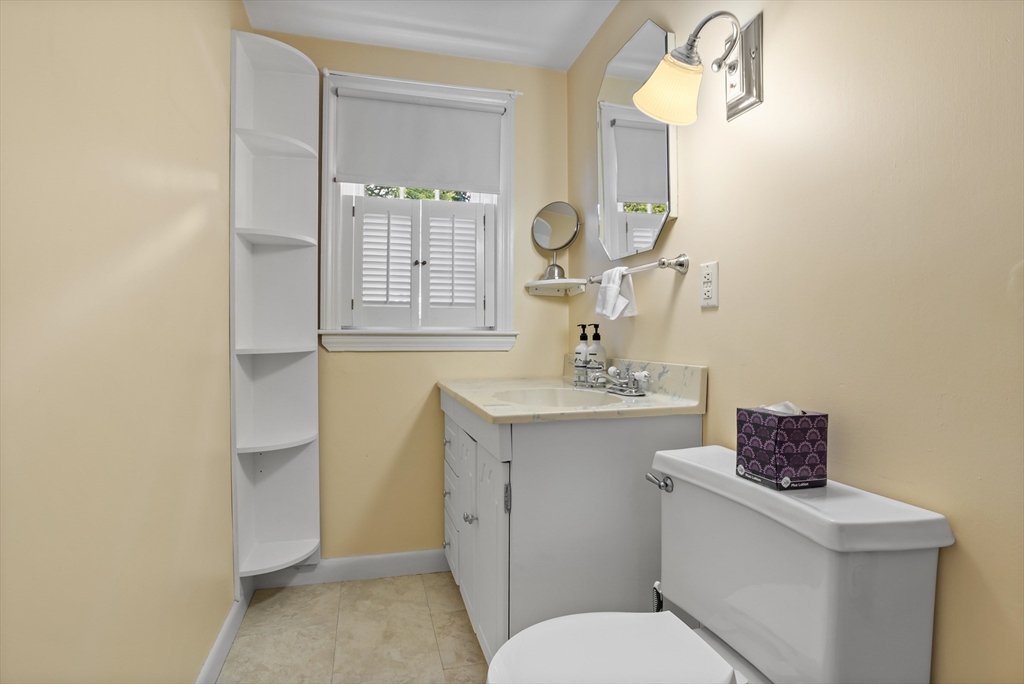 32 Melvin Road Arlington, MA 02474 - Photo 23 of 39 a bathroom with a toilet a sink and mirror