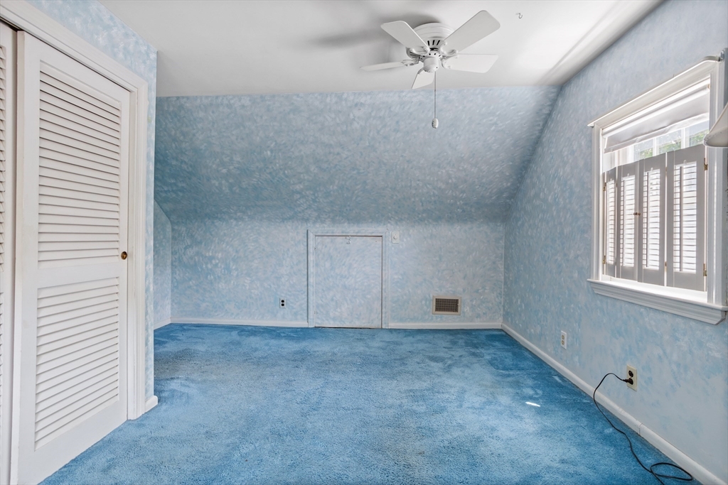 32 Melvin Road Arlington, MA 02474 - Photo 25 of 39 a view of an empty room with a window