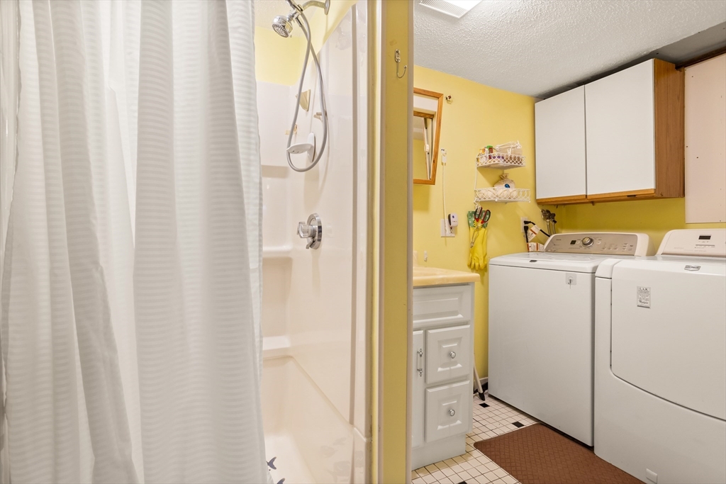 32 Melvin Road Arlington, MA 02474 - Photo 26 of 39 a view of bathroom with a sink dryer and washer