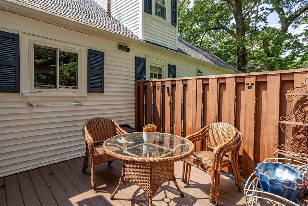 32 Melvin Road Arlington, MA 02474 - Photo 29 of 39 a backyard of a house with table and chairs