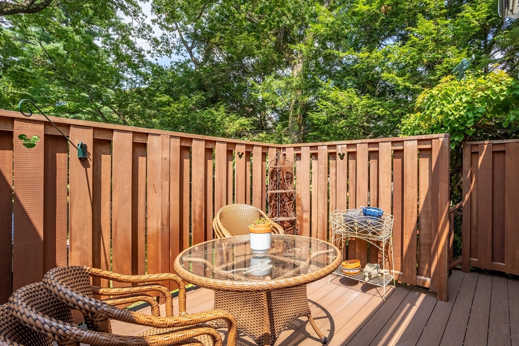 32 Melvin Road Arlington, MA 02474 - Photo 30 of 39 a backyard of a house with table and chairs