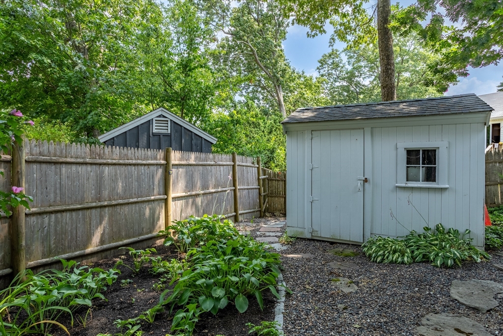 32 Melvin Road Arlington, MA 02474 - Photo 31 of 39 a backyard of a house with lots of green space