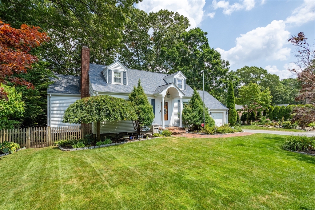 32 Melvin Road Arlington, MA 02474 - Photo 36 of 39 a front view of a house with a garden and yard