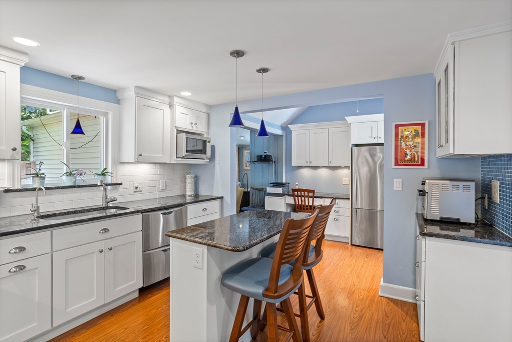 32 Melvin Road Arlington, MA 02474 - Photo 5 of 39 a kitchen with granite countertop a sink appliances cabinets and counter space