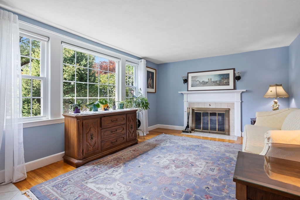 32 Melvin Road Arlington, MA 02474 - Photo 10 of 39 a living room with furniture and a fireplace