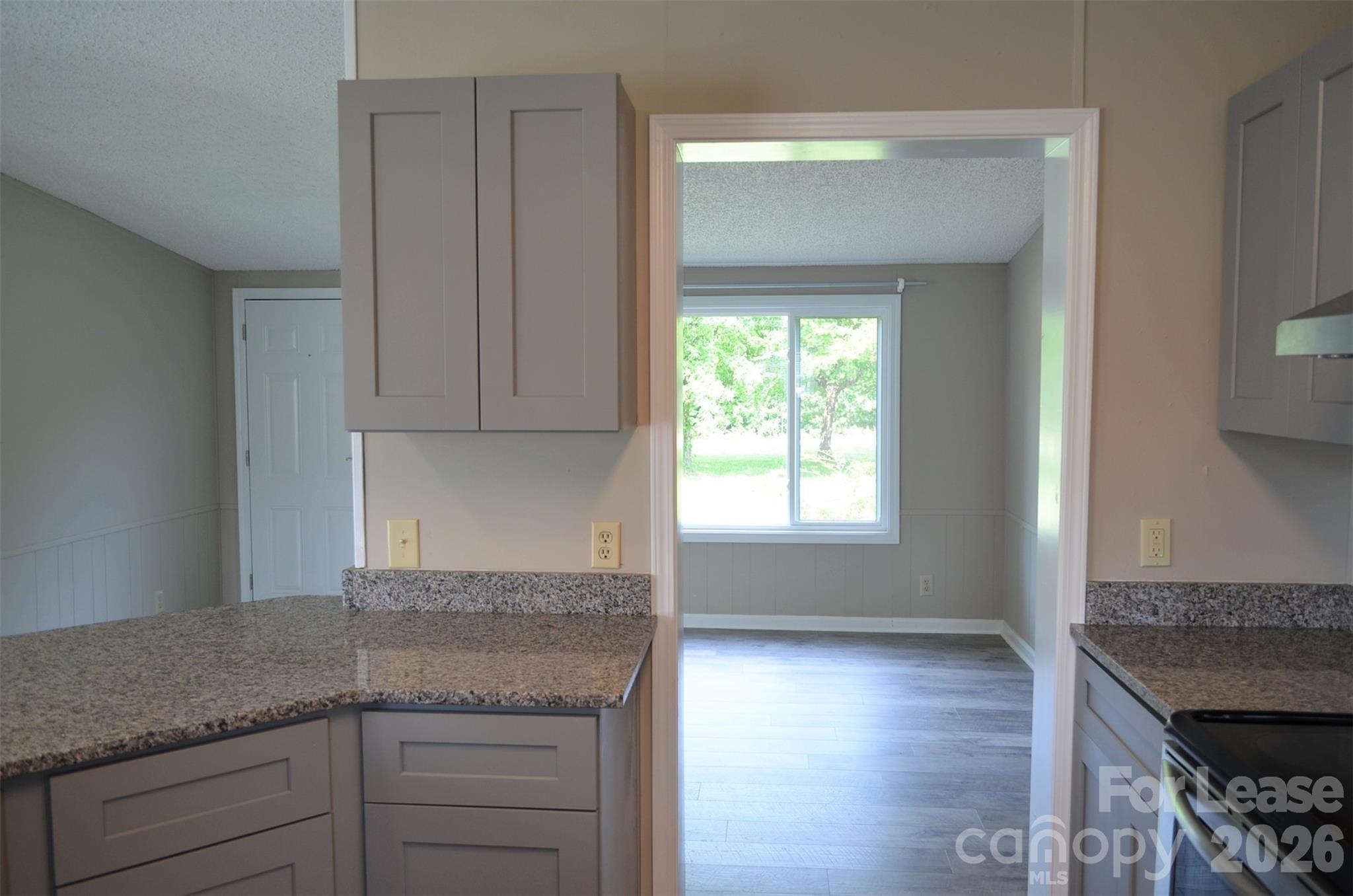 7167 Long Island Road Catawba, NC 28609 - Photo 11 of 34 a kitchen with granite countertop a sink and a stove