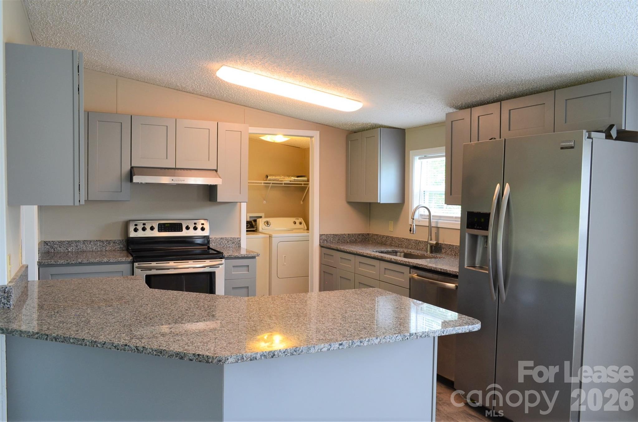 7167 Long Island Road Catawba, NC 28609 - Photo 12 of 34 a kitchen with a stove a refrigerator and a sink