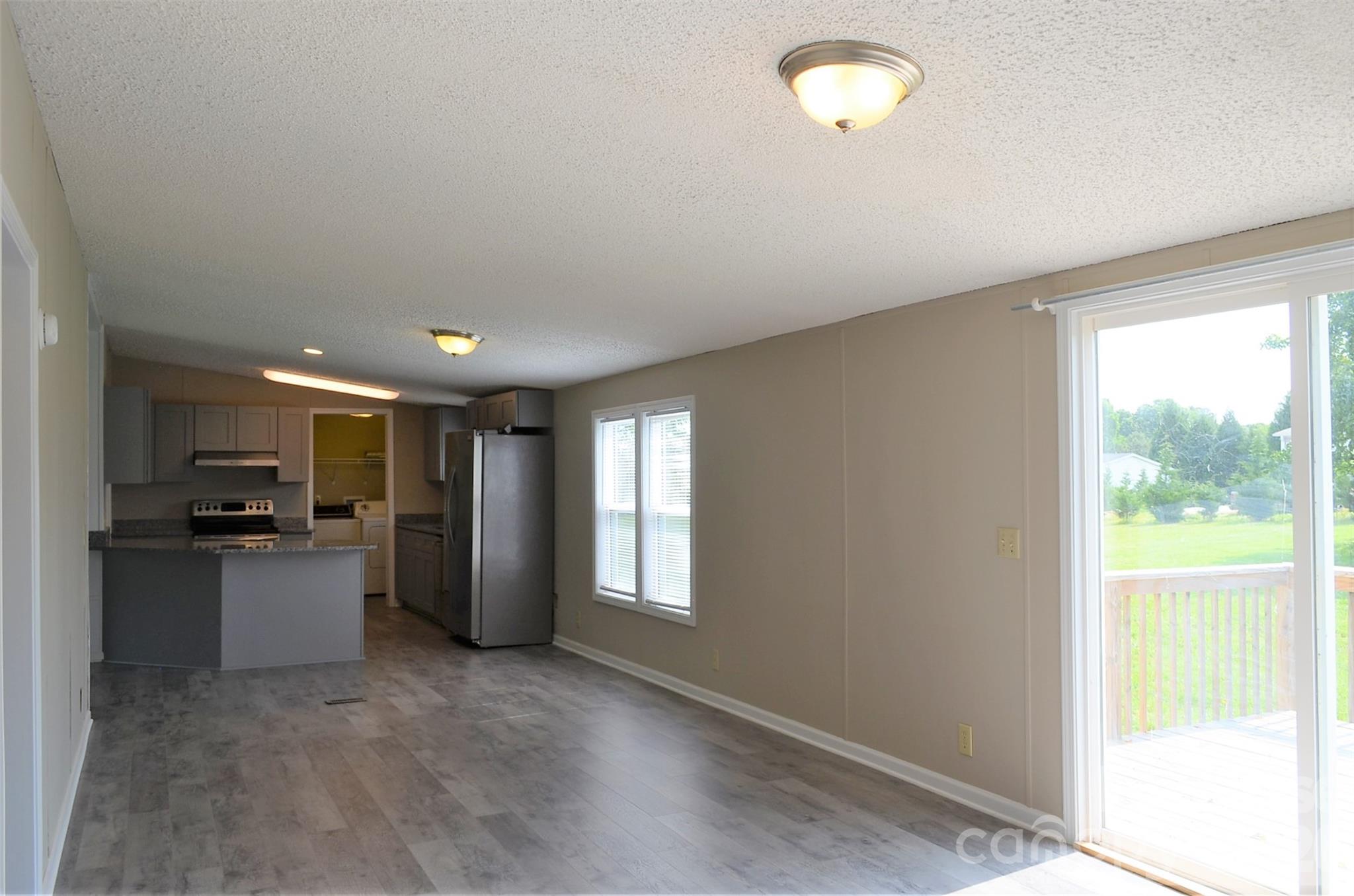 7167 Long Island Road Catawba, NC 28609 - Photo 16 of 34 a kitchen with a refrigerator and a stove top oven