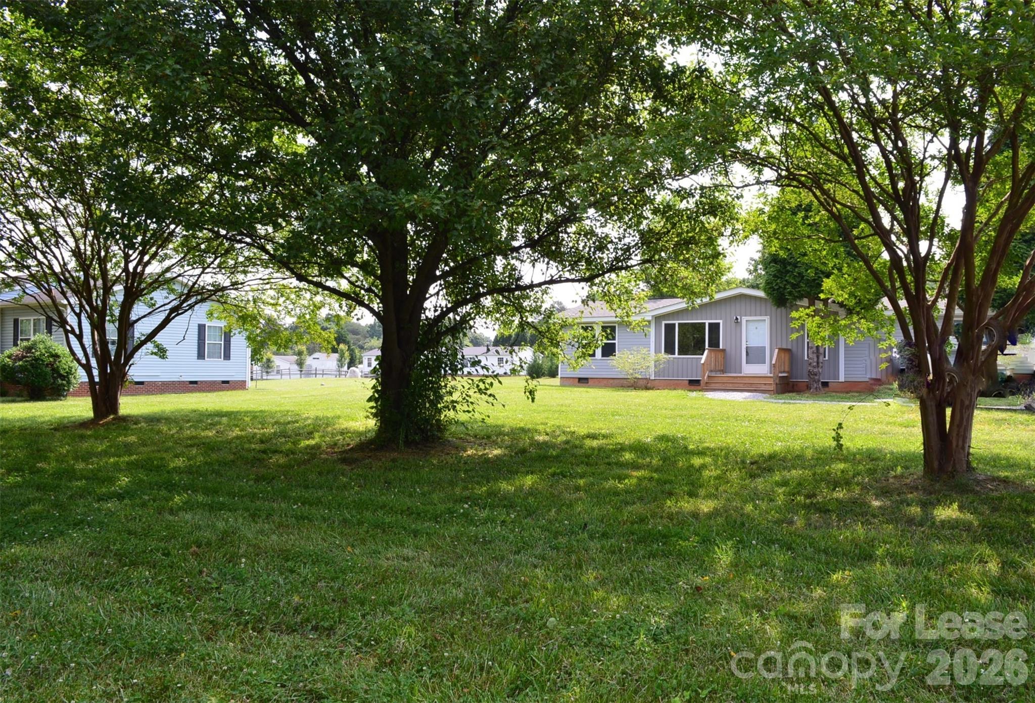 7167 Long Island Road Catawba, NC 28609 - Photo 2 of 34 a house view with a garden and trees