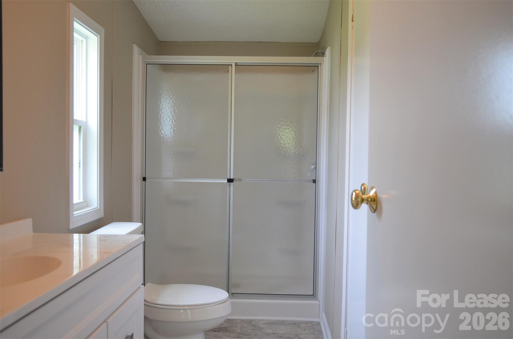 7167 Long Island Road Catawba, NC 28609 - Photo 23 of 34 a bathroom with a shower a toilet and a sink
