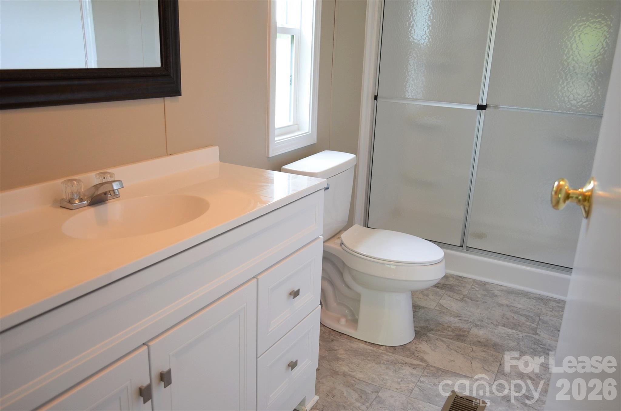 7167 Long Island Road Catawba, NC 28609 - Photo 24 of 34 a bathroom with a sink toilet and shower