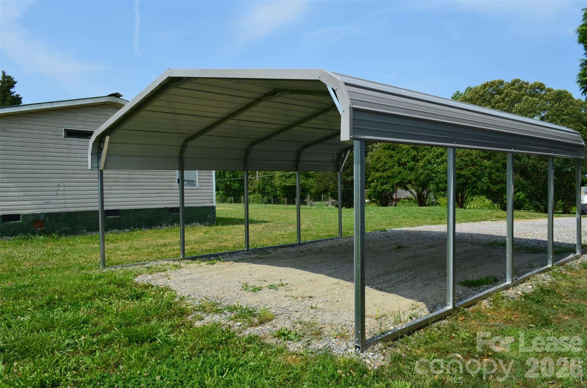 7167 Long Island Road Catawba, NC 28609 - Photo 32 of 34 a backyard of a house with plants and outdoor seating