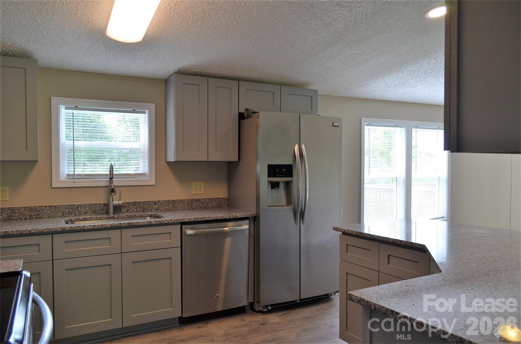 7167 Long Island Road Catawba, NC 28609 - Photo 7 of 34 a kitchen with stainless steel appliances granite countertop a sink stove and refrigerator