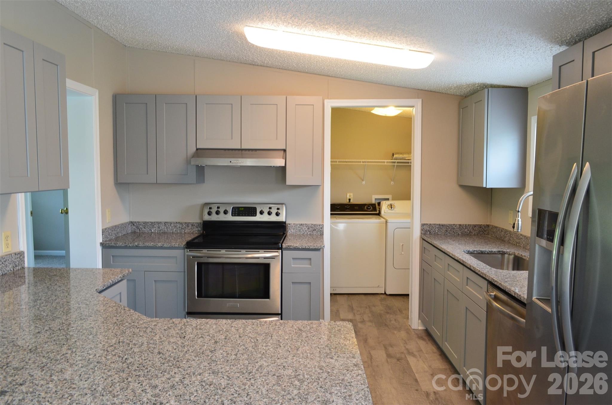7167 Long Island Road Catawba, NC 28609 - Photo 9 of 34 a kitchen with a stove a refrigerator and a sink
