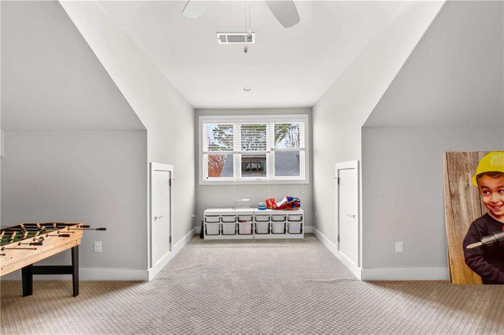 2974 Hermance Drive Northeast Atlanta, GA 30319 - Photo 22 of 38 a bedroom with furniture and a window