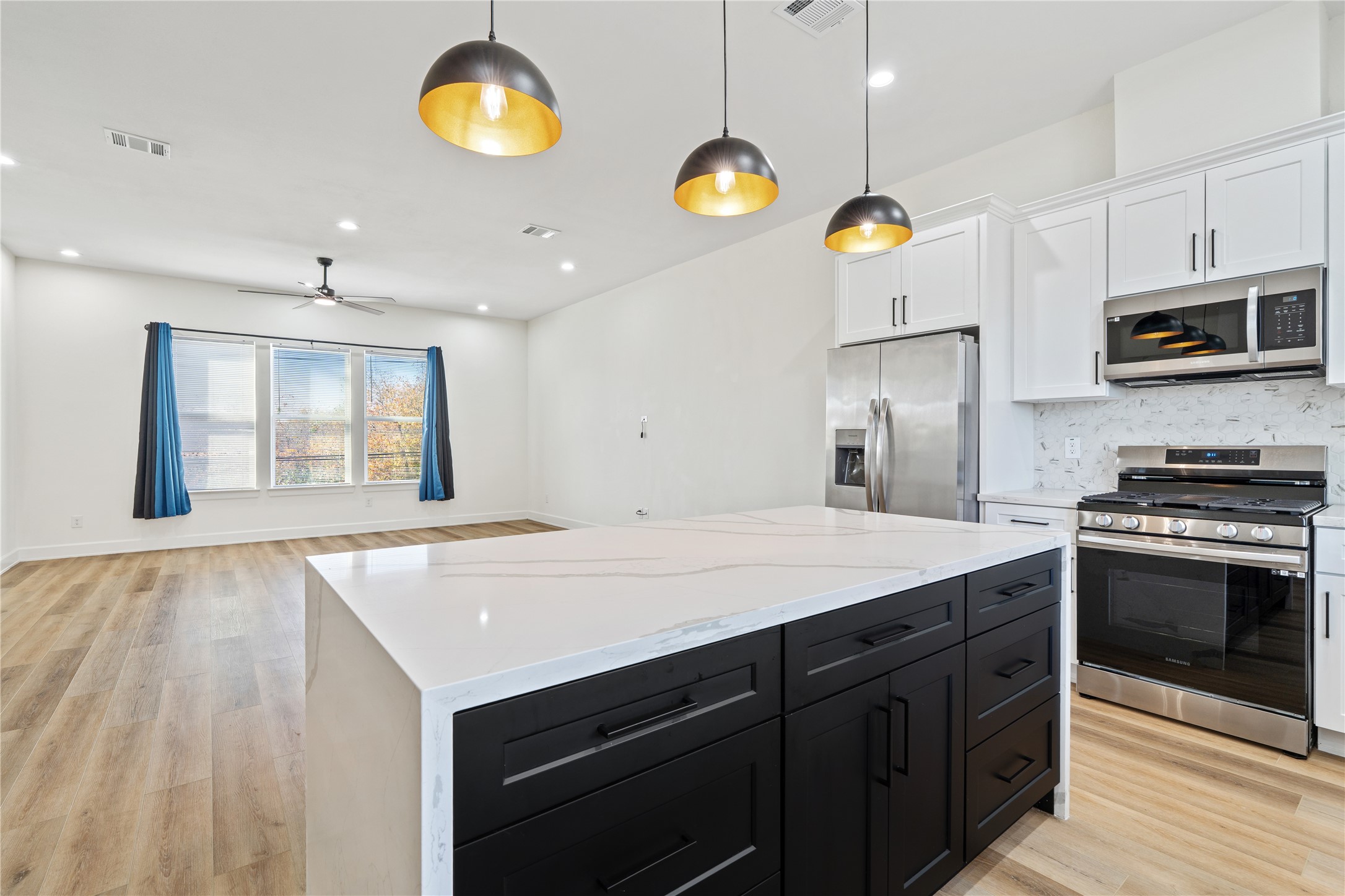 3601 Rebecca Street, Unit C Houston, TX 77021 - Photo 10 of 29 a kitchen with cabinets and wooden floor