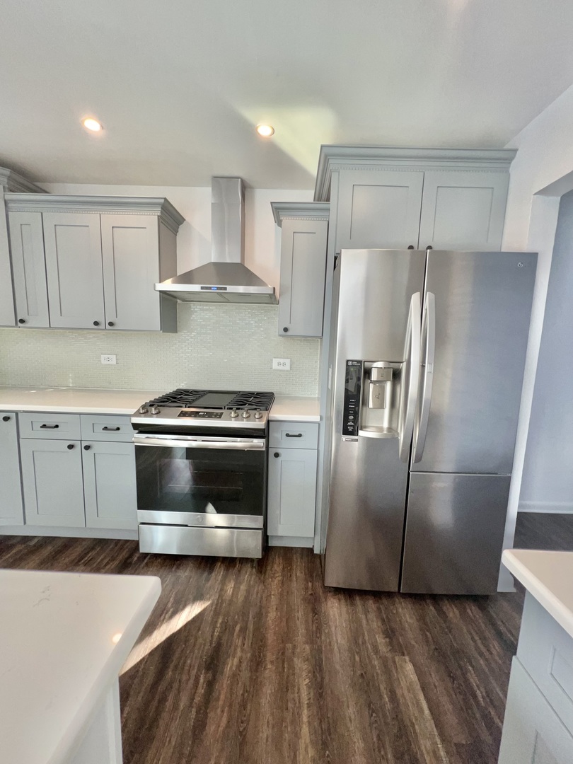 621 Buckboard Road Bolingbrook, IL 60490 - Photo 15 of 38 a kitchen with a refrigerator sink and cabinets