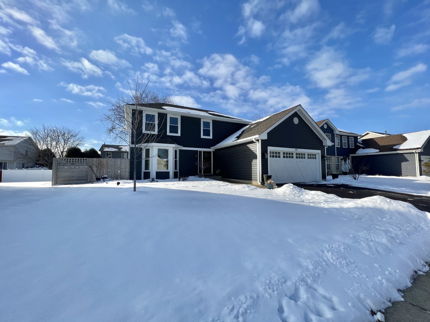 621 Buckboard Road Bolingbrook, IL 60490 - Photo 3 of 38 a front view of a house with a yard