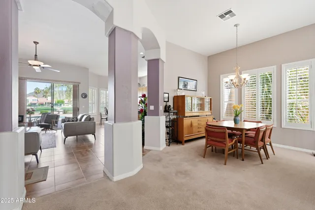 a kitchen with stainless steel appliances granite countertop a sink dishwasher and cabinets with wooden floor